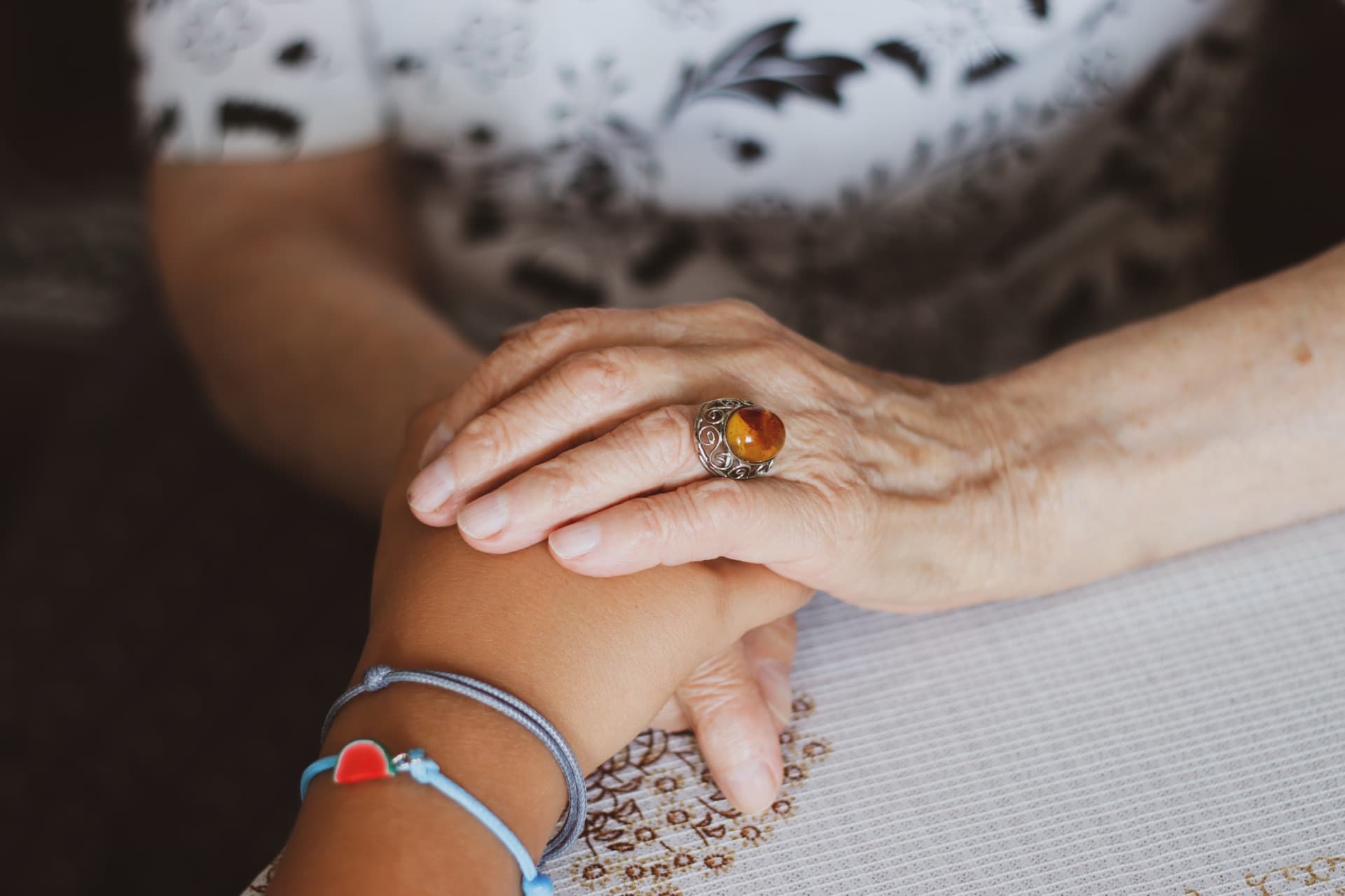Hands gently holding, symbolizing care and remembrance